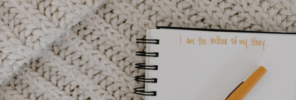 close up shot of a pen on a notebook